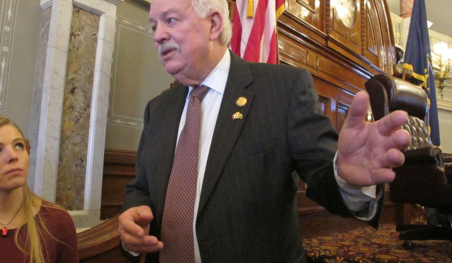 Kansas House Speaker Ray Merrick, R-Stilwell, answers questions from reporters about a state Supreme Court ruling invalidating a school funding law, Thursday, Feb. 11, 2016, at the Statehouse in Topeka, Kan. Merrick is accusing the court of holding taxpayers and schoolchildren hostage by threatening to shut down schools if lawmakers don't pass a new school funding law. (AP Photo/John Hanna)