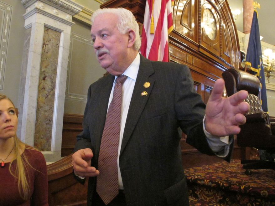 Kansas House Speaker Ray Merrick, R-Stilwell, answers questions from reporters about a state Supreme Court ruling invalidating a school funding law, Thursday, Feb. 11, 2016, at the Statehouse in Topeka, Kan. Merrick is accusing the court of holding taxpayers and schoolchildren hostage by threatening to shut down schools if lawmakers don't pass a new school funding law. (AP Photo/John Hanna)