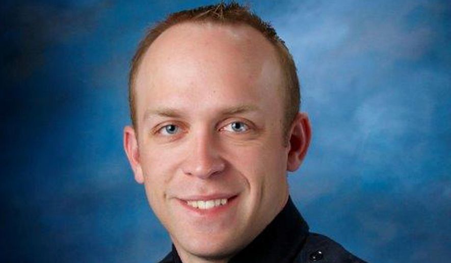 This undated photo released by Fargo Police Department shows Fargo police Officer Jason Moszer. Moszer who was shot amid a standoff in Fargo, N.D., with a domestic violence suspect, police in North Dakota said early Thursday, Feb. 10, 2016. (Fargo Police Department via AP)