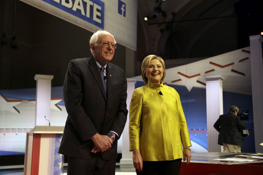 Democratic presidential candidates Sen. Bernie Sanders, I-Vt, left, and Hillary Clinton take the stage before a Democratic presidential primary debate at the University of Wisconsin-Milwaukee, Thursday, Feb. 11, 2016, in Milwaukee. (AP Photo/Tom Lynn) ** FILE **