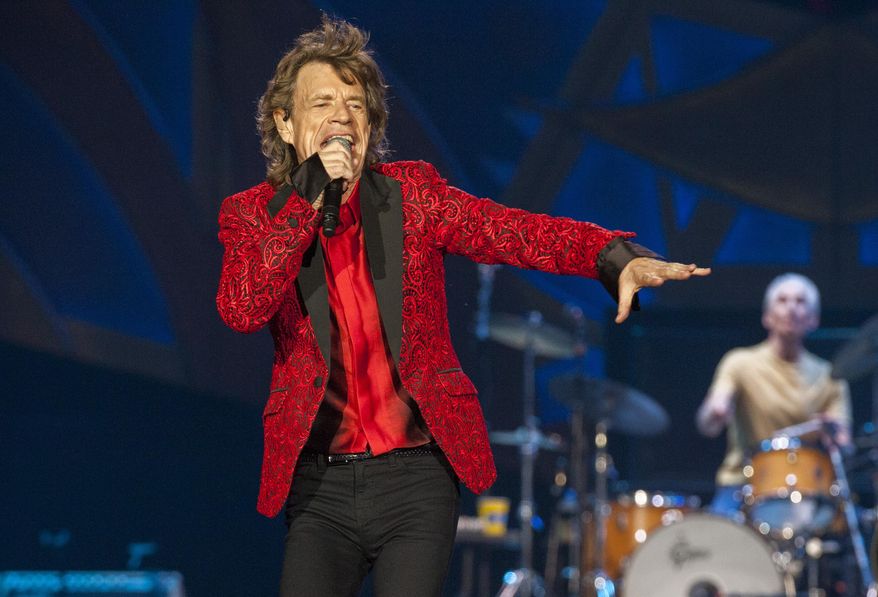 FILE - In this July 4, 2015 file photo, Mick Jagger of the Rolling Stones performs at the Indianapolis Motor Speedway in Indianapolis, Ind. The documentary he produced on James Brown is nominated for best music film at Sunday's Grammys, where it will battle critically acclaimed documentaries on Amy Winehouse and Nina Simone. (Photo by Barry Brecheisen/Invision/AP, File)