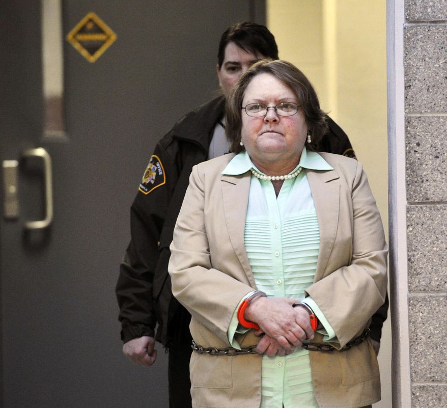 FILE - In a Tuesday, March 10, 2015 file photo, Joyce Hardin Garrard walks to the Etowah County Judicial Building from the Etowah County Detention Center in Gadsden, Ala. Garrad, serving life without parole in her granddaughter, 9-year-old Savannah Hardin's running death, died Friday, Feb. 12, 2016, five days after being stricken at the state’s women’s prison, according to a prison spokesman. (AP Photo/AL.com, Frank Couch, File) MAGS OUT