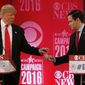 Republican presidential candidate, Sen. Marco Rubio, R-Fla., right, hands Republican presidential candidate, businessman Donald Trump  a tic tac container at a break during the CBS News Republican presidential debate at the Peace Center, Saturday, Feb. 13, 2016, in Greenville, S.C. (AP Photo/John Bazemore) ** FILE **