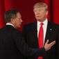 Ohio Gov. John Kasich (left) speaks to businessman Donald Trump  during a commercial break during the CBS News Republican presidential debate at the Peace Center in Greenville, S.C., on Feb. 13, 2016. (Associated Press) **FILE**