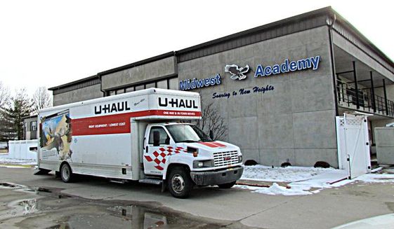 In this photo taken on Thursday, Feb. 11, 2016, a Uhaul is parked outside Midwest Academy in Keokuk, Iowa. Federal, state and county law enforcement officials have returned to the southeast Iowa boarding school for troubled teens following abuse allegations. The Keokuk Daily Gate reports officials with the FBI and the Iowa Division of Criminal Investigation returned to Midwest Academy on Thursday to execute a search warrant for records following an initial search of the academy on Jan. 28 and 29. (Cindy Iutzi/Daily Gate City via AP) MANDATORY CREDIT