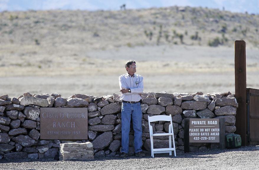 A man guards the entrance to Cibolo Creek Ranch Saturday, Feb. 13, 2016, on U.S. 67 near Shafter, Texas. Supreme Court Justice Antonin Scalia was found dead Saturday morning at the private residence in the Big Bend area of West Texas, after he'd gone to his room the night before and did not appear for breakfast, said Donna Sellers, speaking for the U.S. Marshals Service in Washington. He was 79. (Edward A. Ornelas/The San Antonio Express-News via AP) MAGS OUT, NO SALES, SAN ANOTNIO OUT, AP MEMBERS ONLY, MANDATORY CREDIT, EFE OUT, ONLINE OUT