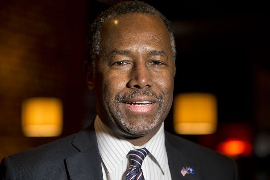 Republican presidential candidate Ben Carson speaks to members of the media before a Valentine's Day dinner with his wife and a group of doctors during a private event at the Blue Marlin restaurant in Columbia, S.C., Sunday, Feb. 14, 2016. (AP Photo/Jacquelyn Martin)
