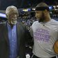 NBA legend  Bill Russell, left, talks with Sacramento Kings center DeMarcus Cousins before the Kings played the Dallas Mavericks  in an NBA basketball game in Sacramento, Calif., Thursday,  Feb. 5, 2015.(AP Photo/Rich Pedroncelli)