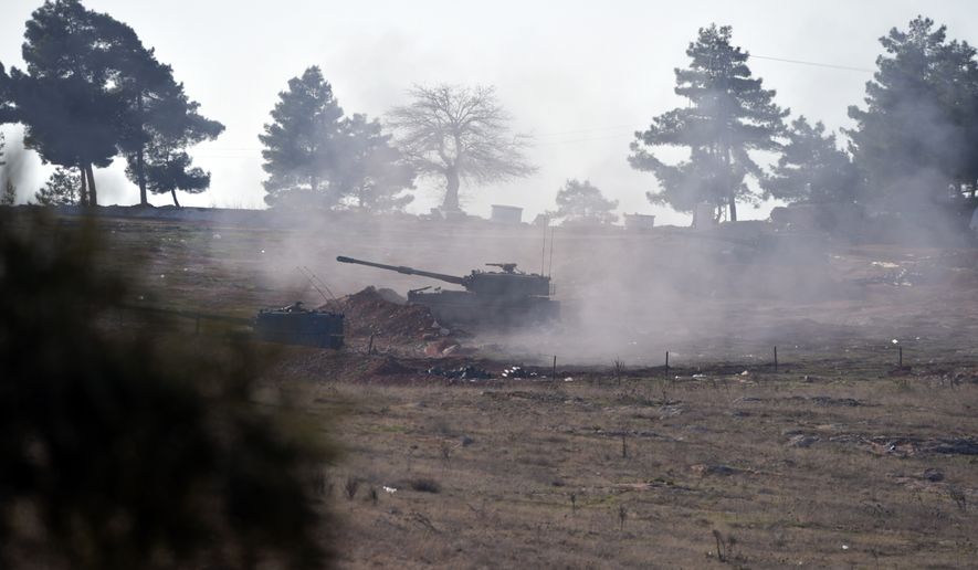Turkish artillery fire from the border near Kilis toward northern Syria, in Kilis, Turkey, Monday, Feb. 15, 2016. Turkey defied international calls and shelled parts of northern Syria for a third day today, insisting it would not allow Kurdish-led forces to seize key areas along the border. The cross-border Turkish artillery fire, which began on Saturday, has added to an increasingly complex situation in Syria&#39;s northern Aleppo province just days before the cease fire is due to begin.(AP Photo/Halit Onur Sandal)