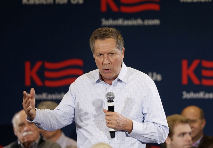 Republican presidential candidate, Ohio Gov. John Kasich meets with supporters during a town hall meeting, Tuesday, Feb. 16, 2016, in Livonia, Mich. (AP Photo/Carlos Osorio)
