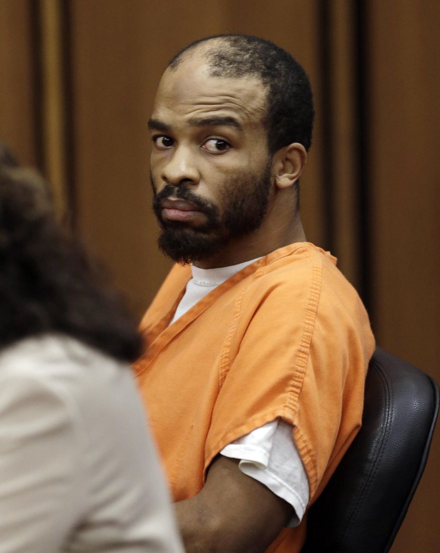 FILE - In this Tuesday, Aug. 20, 2013, file photo, Michael Madison looks toward the prosecuting attorney during a pretrial hearing, in Cleveland. A judge has granted a motion by defense attorneys that prevents prosecutors from comparing Madison, a man who faces a trial for killing three women in northeast Ohio, with notorious serial killer Anthony Sowell. Madison’s trial is scheduled to begin April 4 in Cleveland. (AP Photo/Tony Dejak, File)