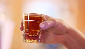 A shot of Fireball whiskey is held at Buck&#x27;s Saloon on Feb. 6, 2016 in Melba, Idaho. (Adam Eschbach/Idaho Press-Tribune via AP)