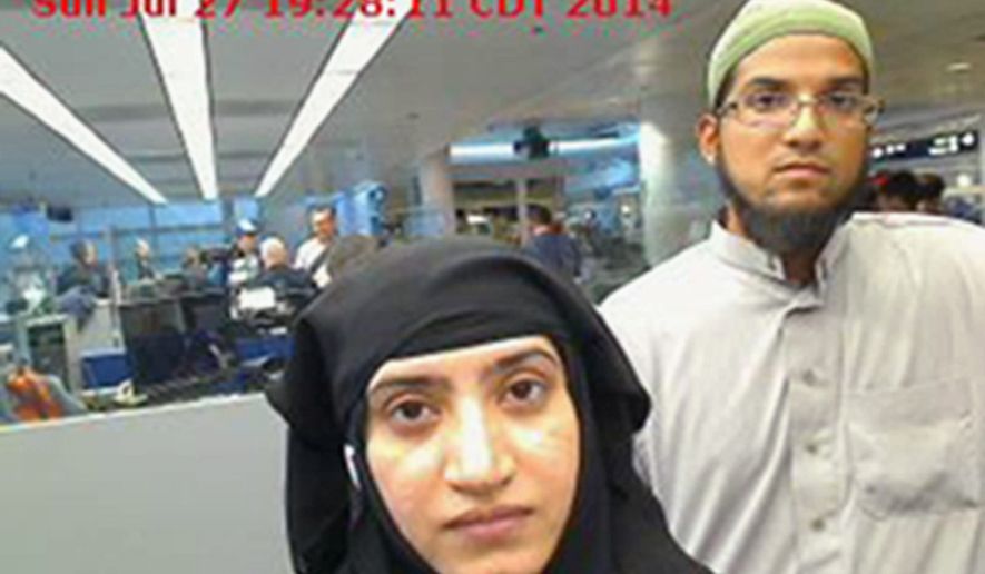 This July 27, 2014, file photo provided by U.S. Customs and Border Protection shows Tashfeen Malik, left, and Syed Farook, as they passed through O'Hare International Airport in Chicago. (U.S. Customs and Border Protection via AP)