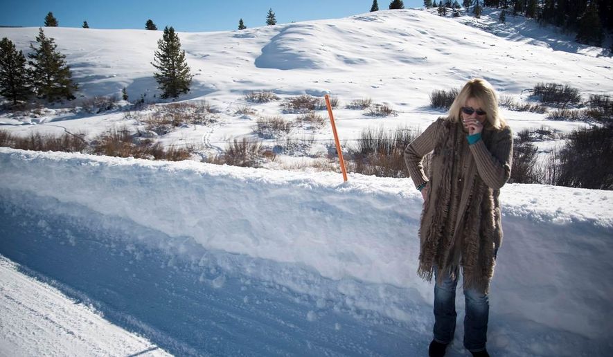 In this Jan. 28, 2016, photo, Lillian Edick becomes emotional while visiting the site of her brother’s 2007 murder on Rim Road in Hoback Ranches near Bondurant, Wyo. On Jan. 27, Matthew Rae Vincent, of Big Piney, was sentenced to spend the next 30 to 50 years in prison as part of a plea deal after admitting that he stabbed Nystrom in the neck with a pocket knife, then beat him to death with rocks he found in that spot along the Rim Road. (Bradly J. Boner/Jackson Hole News & Guide via AP) MANDATORY CREDIT