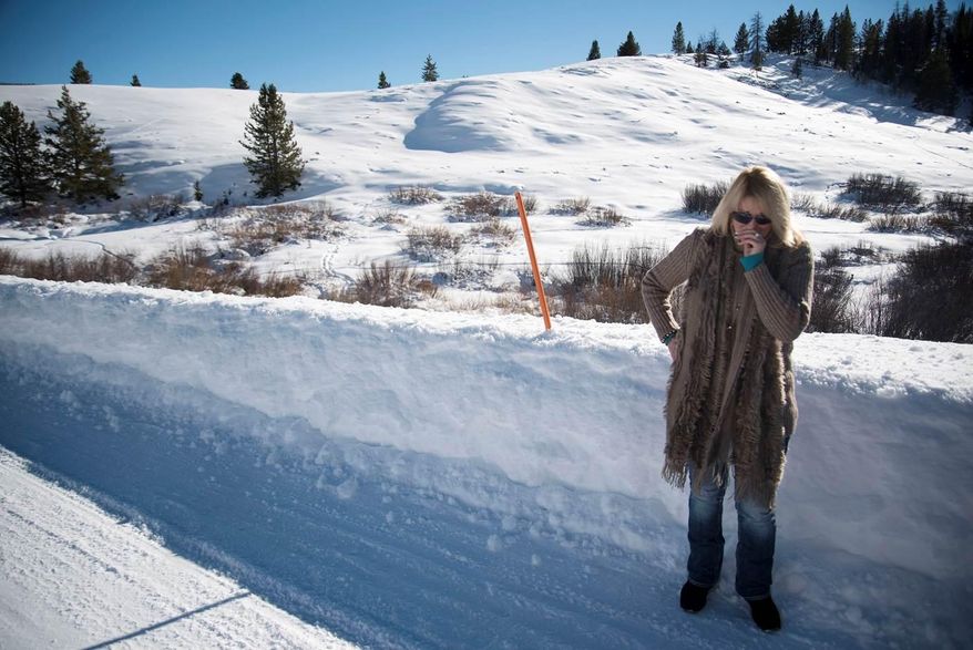 In this Jan. 28, 2016, photo, Lillian Edick becomes emotional while visiting the site of her brother’s 2007 murder on Rim Road in Hoback Ranches near Bondurant, Wyo. On Jan. 27, Matthew Rae Vincent, of Big Piney, was sentenced to spend the next 30 to 50 years in prison as part of a plea deal after admitting that he stabbed Nystrom in the neck with a pocket knife, then beat him to death with rocks he found in that spot along the Rim Road. (Bradly J. Boner/Jackson Hole News & Guide via AP) MANDATORY CREDIT