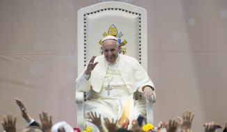 Pope Francis salutes faithful during his meeting with workers and advocacy groups in Ciudad Juarez, Mexico, Wednesday, Feb. 17, 2016.  Francis is on his way back to Italy after a five-day visit in Mexico. (L&#39; Osservatore Romano/Pool photo via AP)