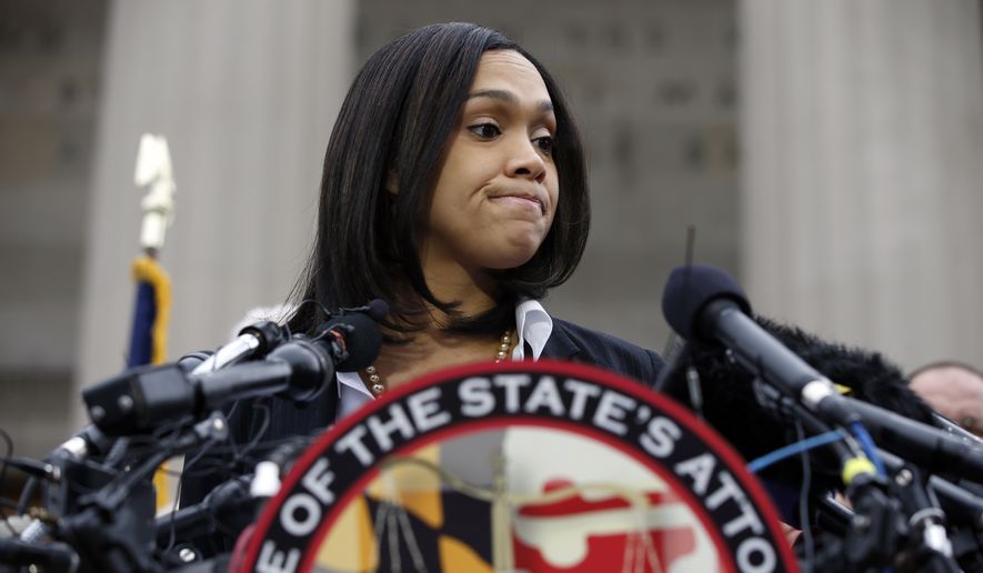 Marilyn Mosby, Baltimore state&#x27;s attorney, pauses while speaking during a media availability on May 1, 2015, in Baltimore. Mosby announced criminal charges against all six officers suspended after Freddie Gray suffered a fatal spinal injury while in police custody. (Associated Press) **FILE**