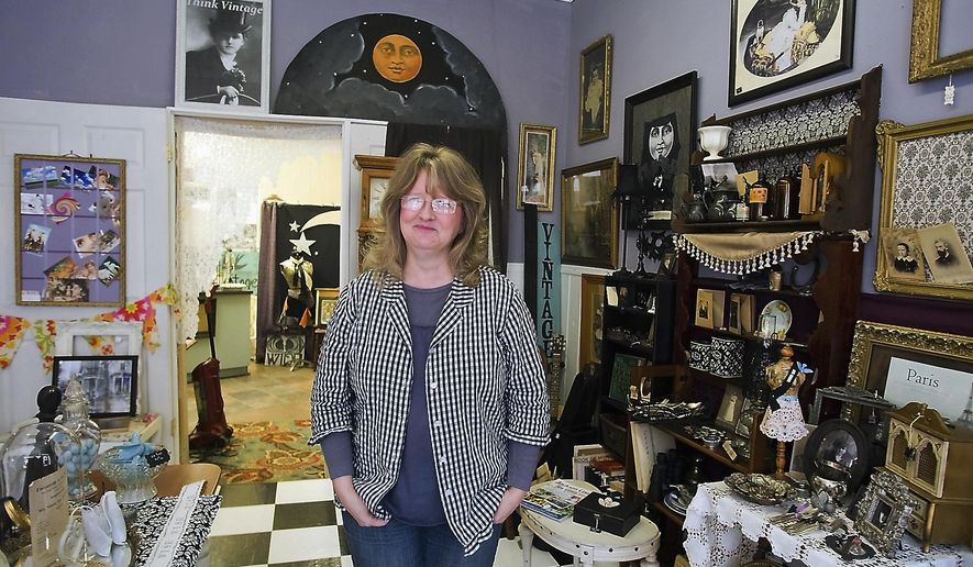 In this Feb. 3, 2016 photo, Andrea Stephens poses for a photo inside in her business, Think Vintage, in Murphysboro, Ill. Stephens returned to Southern Illinois from California where she had a similar business. Hers is one of the newest additions to the growing landscape of women-owned businesses in Murphysboro. (Richard Sitler/The Southern via AP)