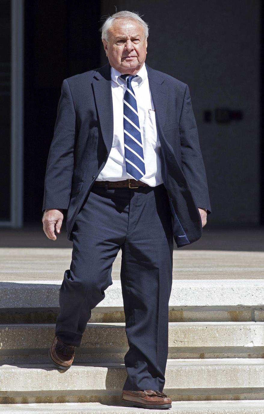 Donald Vidrine, a BP well site leader from the 2010 Deepwater Horizon oil rig explosion, leaves Federal Court during a break in the trial of Deepwater Horizon supervisor Robert Kaluza in New Orleans, Thursday, Feb. 18, 2016. Vidrine, who pleaded guilty to a pollution charge in connection with the 2010 oil spill testified against Kaluza. (AP Photo/Max Becherer)