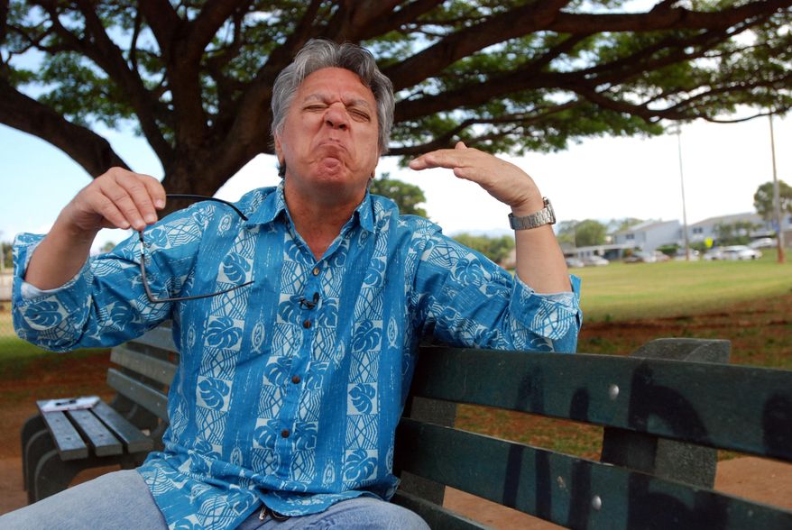 In this Jan. 28, 2016 photo, comedian Andy Bumatai gestures during an interview in Mililani, Hawaii. News reports on census data showing the number of Pidgin speakers in Hawaii have helped spark a sense of pride among those who speak the language in their homes. (AP Photo/Audrey McAvoy)