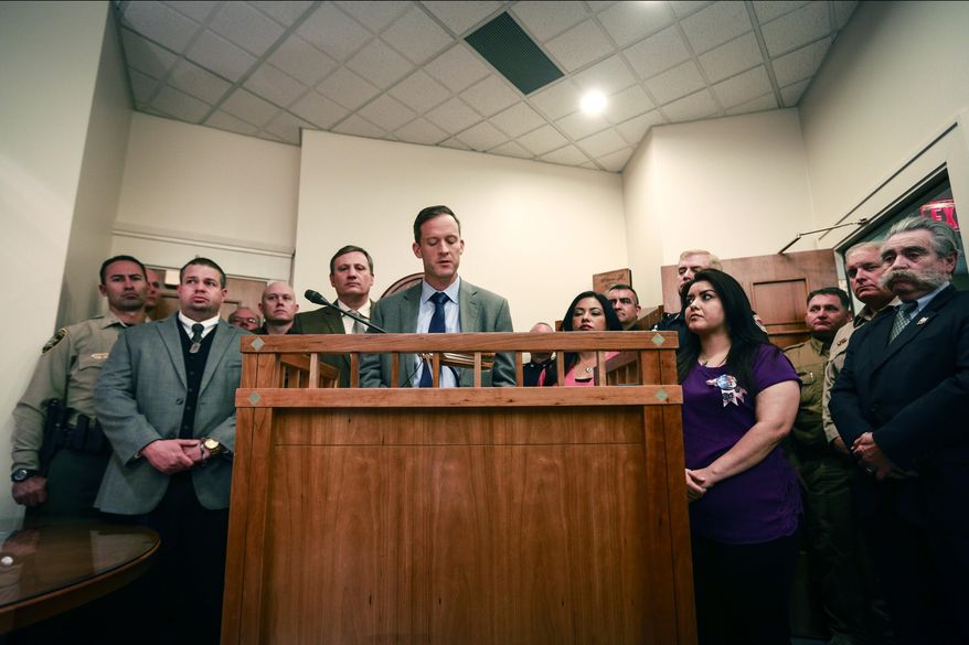 Rep. Nate Gentry speaks to members of the press after the adjournment of the legislative session in the House Speaker's office, Thursday, Feb. 18, 2016 in Santa Fe, N.M. The New Mexico Legislature wrapped up its work Thursday with major political compromises in place to revise driver's licenses for immigrants, overhaul the state's bail bond system and trim spending next year to offset plunging state revenue linked to oil income. (AP Photo/Juan Labreche)