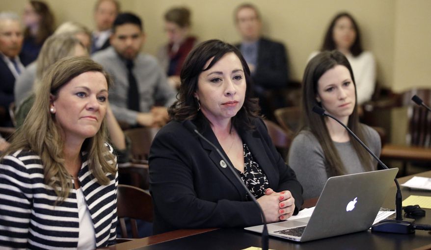 Salt Lake City Democrat Rep. Angela Romero, center, prepares to testify as Melissa Ridgway Kraft, left, and Stephanie Pitcher look on at the Utah State Capitol Thursday, Feb. 18, 2016, in Salt Lake City. A plan to give state and higher education workers six weeks paid time off when they become new parents appears to be dead for the year after lawmakers sited confusion over its estimated cost. Members of a business committee voted 9-1 in favor of studying the plan in the legislative session's off season and possibly introducing it again next year. (AP Photo/Rick Bowmer)