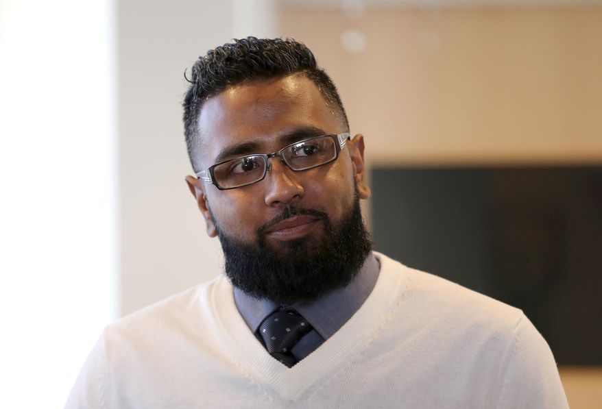 Didarul Sarder, 32, of Warren, Mich., arrives at the Warren City Hall where he was honored by Warren Mayor Jim Fouts on Thursday, Feb. 18, 2016. Fouts holds ceremony to honor Didarul Sarder for intervening in the stabbing of a GM Tech Center employee. (Jessica J. Trevino/Detroit Free Press. (Jessica Trevino/Detroit Free Press via AP) MANDATORY CREDIT