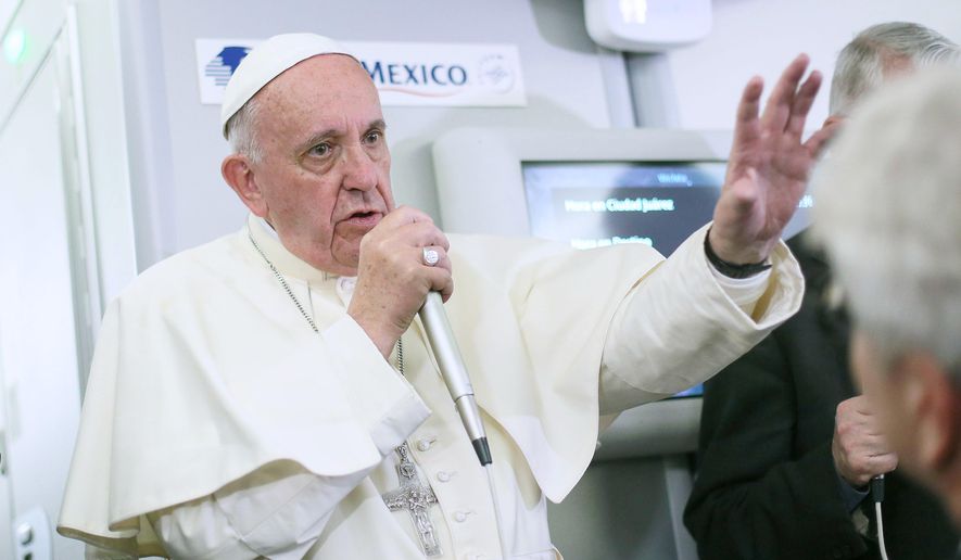 Pope Francis meets journalists aboard the plane during the flight from Ciudad Juarez, Mexico, to Rome on Feb. 17, 2016. (Associated Press)