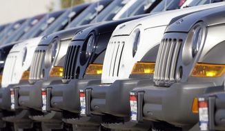 A long line of unsold 2006 Jeep Libertys sit on the back lot of a Chrysler Jeep dealership in the southeast Denver suburb of Centennial, Colo., in this Oct. 22, 2006 file photo.  (AP Photo/David Zalubowski, File) **FILE**