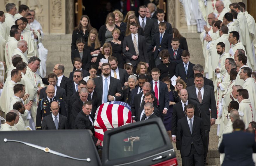 The casket containing the body of the late Supreme Court Associate Justice Antonin Scalia leaves the Basilica of the National Shrine of the Immaculate Conception in Washington following funeral mass services, Saturday, Feb. 20, 2016. (AP Photo/Pablo Martinez Monsivais)