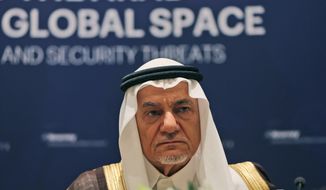 Former director of the Saudi Arabia General Intelligence Directorate, Prince Turki Bin Faisal Al Saud, and a member of the board of the Beirut Institute, talk during a press conference in Abu Dhabi, United Arab Emirates, Sunday, Feb. 21, 2016. The prominent Saudi prince said Sunday that Muslim countries need to take the lead in fighting terrorism and that a recently announced Islamic counterterrorism alliance of 34 nations should have been created sooner. (AP Photo/Kamran Jebreili)
