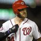 Washington Nationals&#39; Bryce Harper walks back to the dugout after he popped out during the third inning of a baseball game against the Baltimore Orioles, Tuesday, Sept. 22, 2015, in Washington. The Orioles won 4-1. (AP Photo/Nick Wass)