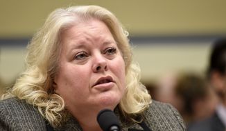 In this June 24, 2015, file photo, Office of Personnel Management (OPM) Chief Information Officer Donna K. Seymour testifies on Capitol Hill in Washington. Seymour has resigned days before a congressional oversight committee hearing on the breach. (AP Photo/Susan Walsh, File)