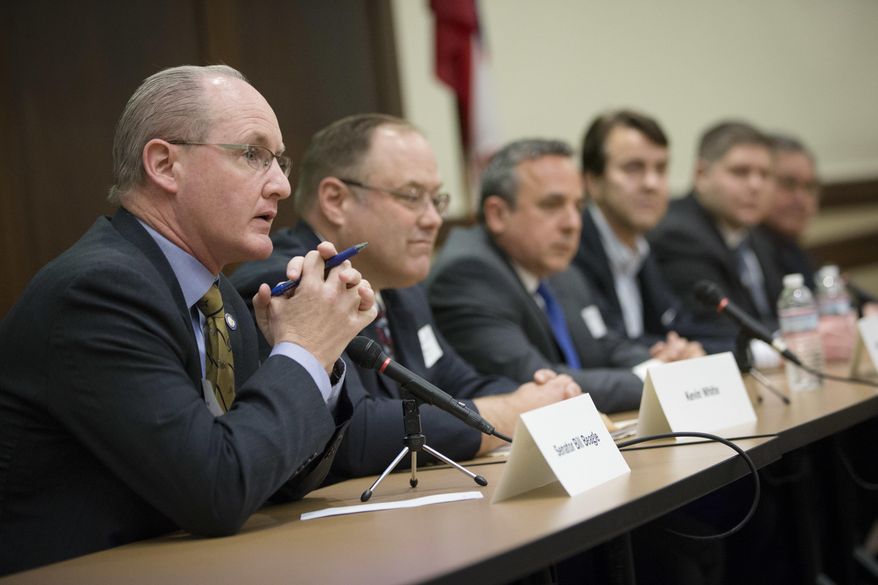 Ohio Republican state senator Bill Beagle, left, speaks during the 8th Congressional District Candidate Forum at the Miami University learning center Monday, Feb. 22, 2016, in West Chester, Ohio. Fourteen of the 17 candidates running attended the forum Monday as they vied to succeed John Boehner in his western Ohio House seat. Boehner retired last year after first winning the seat in 1990. (AP Photo/John Minchillo)