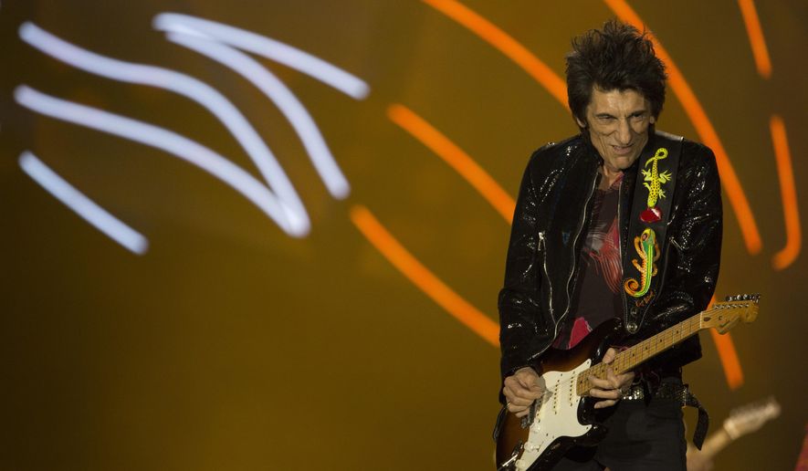 Ron Wood of the Rolling Stones performs at the Maracana stadium in Rio de Janeiro, Brazil, Saturday, Feb. 20, 2016. (AP Photo/Leo Correa)
