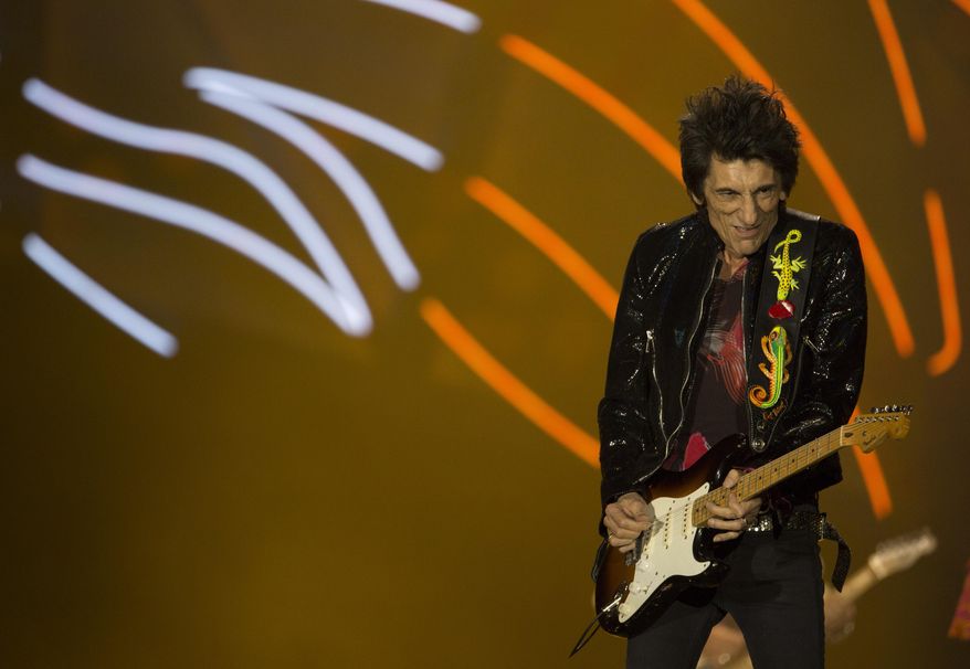 Ron Wood of the Rolling Stones performs at the Maracana stadium in Rio de Janeiro, Brazil, Saturday, Feb. 20, 2016. (AP Photo/Leo Correa)