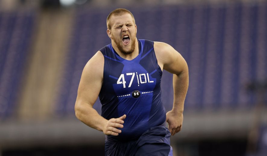 Iowa offensive lineman Brandon Scherff pulls up after running a drill at the NFL football scouting combine in Indianapolis, Friday, Feb. 20, 2015. (AP Photo/David J. Phillip)