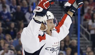 Washington Capitals center Jay Beagle celebrates after scoring against the Tampa Bay Lightning during the first period of an NHL hockey game Saturday, Dec. 12, 2015, in Tampa, Fla. (AP Photo/Chris O&#x27;Meara)