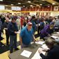 Crowds of people line up to get a ballot at a Republican caucus site, Tuesday, Feb. 23, 2016, in Las Vegas. (AP Photo/John Locher)