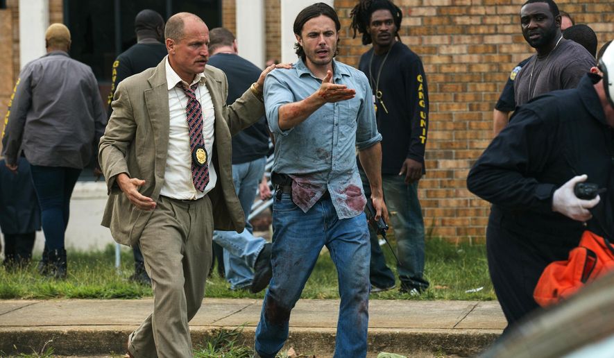 This image released by Open Road Films shows Woody Harrelson, left, and Casey Affleck in a scene from "Triple 9." (Bob Mahoney/Open Road Films via AP)
