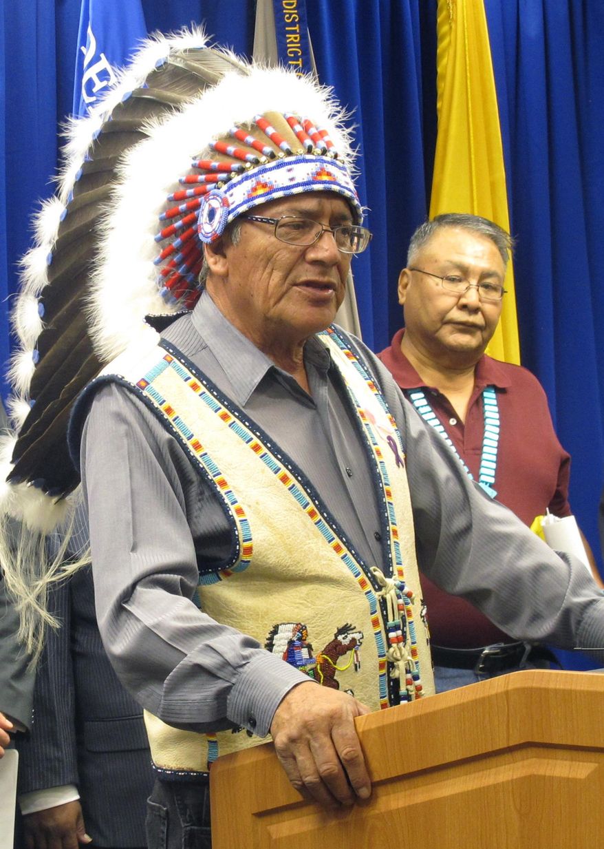 FILE - In this Sept. 17, 2015 file photo Oglala Sioux President John Yellow Bird Steele speaks during a news conference at the U.S. Attorney's Office in Albuquerque, N.M. A judge on Tuesday, Feb. 23, 2016, has approved a nearly $1 billion settlement between the Interior Department and Native American tribes over a decades-old claim that the government inadequately compensated tribes while they managed education, law enforcement and other federal services. (AP Photo/Mary Hudetz, File)