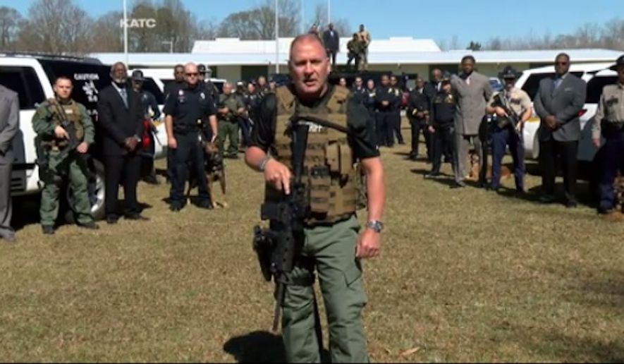 Capt. Clay Higgins of the Acadiana Sheriff&#39;s Office in Louisiana stands in front of community members and law enforcement in a video urging the community to help capture members of the violent &quot;Gremlins gang.&quot; (Image: KATC) 