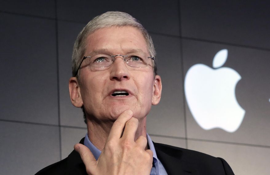 FILE - In this April 30, 2015 file photo, Apple CEO Tim Cook responds to a question during a news conference at IBM Watson headquarters, in New York. There’s a deeply American conflict behind the unfolding battle between the tech industry and the federal government, over the FBI’s demand for Apple to help it unlock an extremist killer’s encrypted iPhone. (AP Photo/Richard Drew, File)