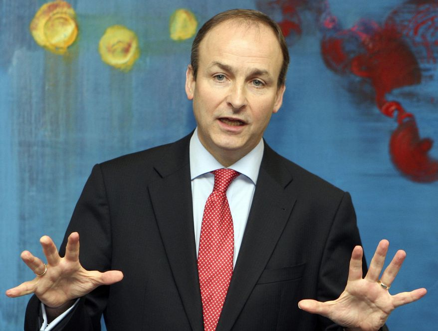 FILE - A Monday Feb. 22, 2010 file photo of Fianna Fail leader Micheal Martin addressing the media at the Irish embassy in Brussels. The three parties emerging strongest from the Friday Feb. 26, 2016 election _ Fine Gael, Fianna Fail and Sinn Fein _ all claim to be the one true church of Irish republicanism. Each claims direct succession from the Dublin rebels who challenged British rule in the Easter Rising of 1916. And all three, in their own way, are right. (AP Photo/Yves Logghe, File)