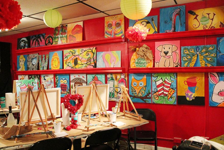 ADVANCE FOR THE WEEKEND OF FEB. 29 - This Feb. 18, 2016 photo shows Addie's Baby Paint and Wine Studio in Florence, S.C. Seventy to 100 people attend classes at the studio each week. (Shamira McCray/The Morning News via AP) MANDATORY CREDIT