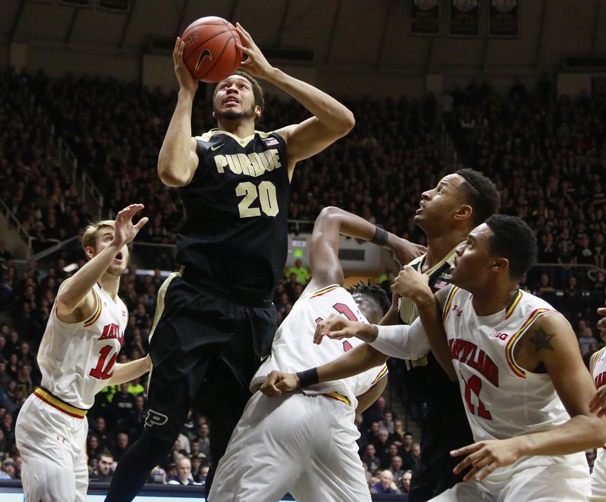 Purdue center A.J. Hammons (20) shoots between Maryland forwards Jake Layman, left, and Jared Nickens, right, Maryland center Diamond Stone, center, and Purdue forward Vince Edwards, second from right, in the second half of an NCAA college basketball game, Saturday, Feb. 27, 2016, in West Lafayette, Ind. (AP Photo/R Brent Smith)