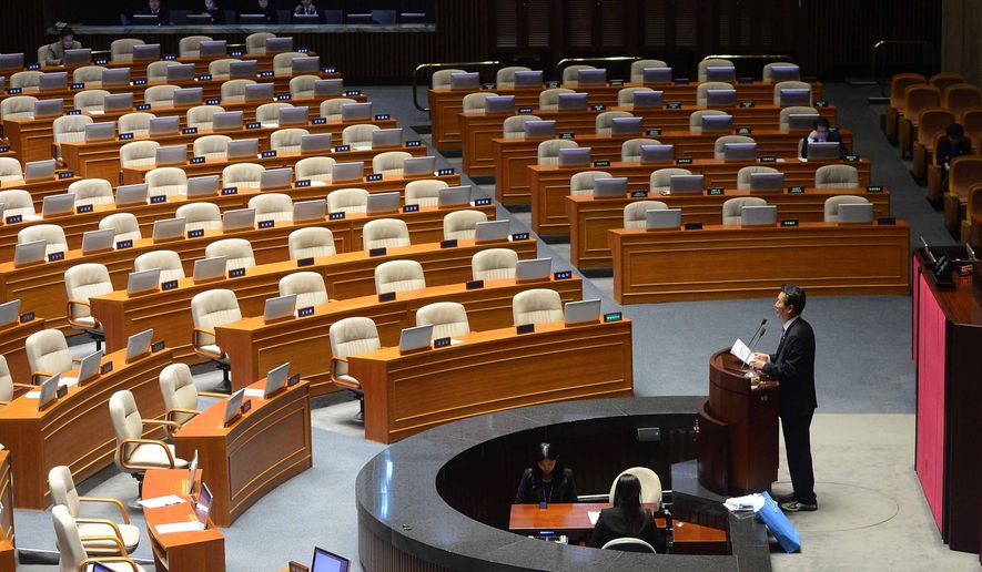 Rep. Jung Cheong Rae, right, of the main opposition Minjoo Party of Korea speaks at the National Assembly in Seoul, South Korea, Saturday, Feb. 27, 2016. South Korea's opposition lawmakers on Saturday continued their nonstop speeches for a fifth straight day in parliament to block a vote on a government-backed anti-terrorism bill that they say would threaten personal freedoms and privacy if passed into law. (Kim Hyun-tae/Yonhap via AP) KOREA OUT