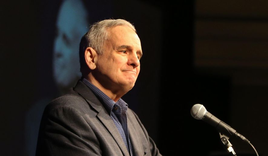 While hosting the first-ever Governor's Water Summit, Minnesota Gov. Mark Dayton's speech was briefly interrupted by protesters, some of whom asked why Native American representatives were not invited to the table and also calling to block a proposed oil pipeline through Minnesota Saturday, Feb. 27, 2016, at the InterContinental Saint Paul Riverfront. Here, Dayton paused from his speech as protesters came into the room. (David Joles/Star Tribune via AP)