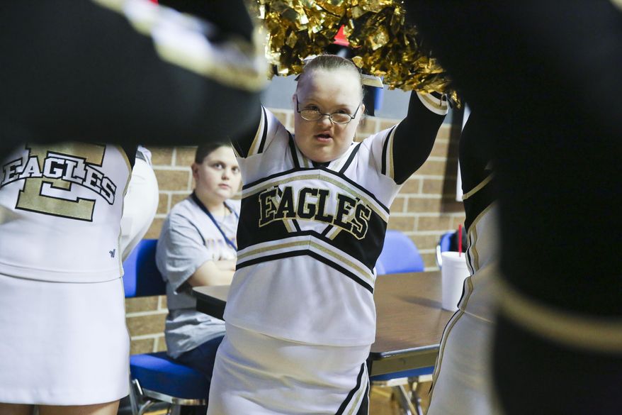 East Lawrence eighth grader Savannah Newman joins the squad for the regional championship semifinal against Deshler at Wallace State in Hanceville, Ala., on Feb. 22, 2016. East Lawrence is one of three high schools in the state with a cheerleading squad for special- needs students(Crystal Vander Weit/The Decatur Daily via AP) MANDATORY CREDIT