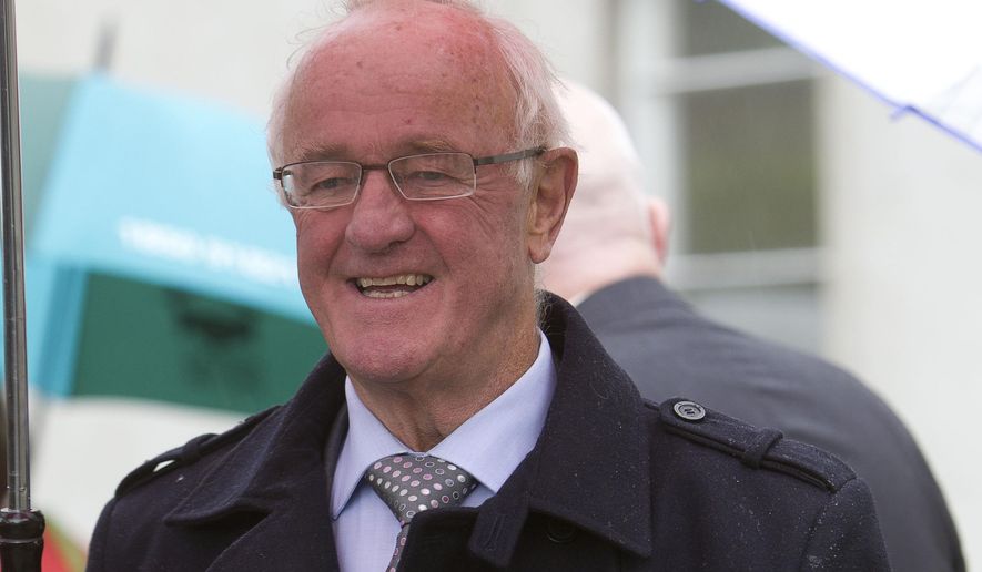 FILE - An Aug. 3, 2012 photo from files of actor Frank Kelly, walking in Dublin, Ireland. Kelly, best known for playing a foul-mouthed priest with a fondness for spouting the words “Feck! Drink! Girls!’’ in the series ‘Father Ted,’ has died at age 77. Ireland’s president Michael Higgins was among the many prominent Irish figures offering tributes to Kelly on Sunday, Feb. 28, 2016, describing it as a privilege to have him as a friend. (Liam McBurney/PA via AP) UNITED KINGDOM OUT